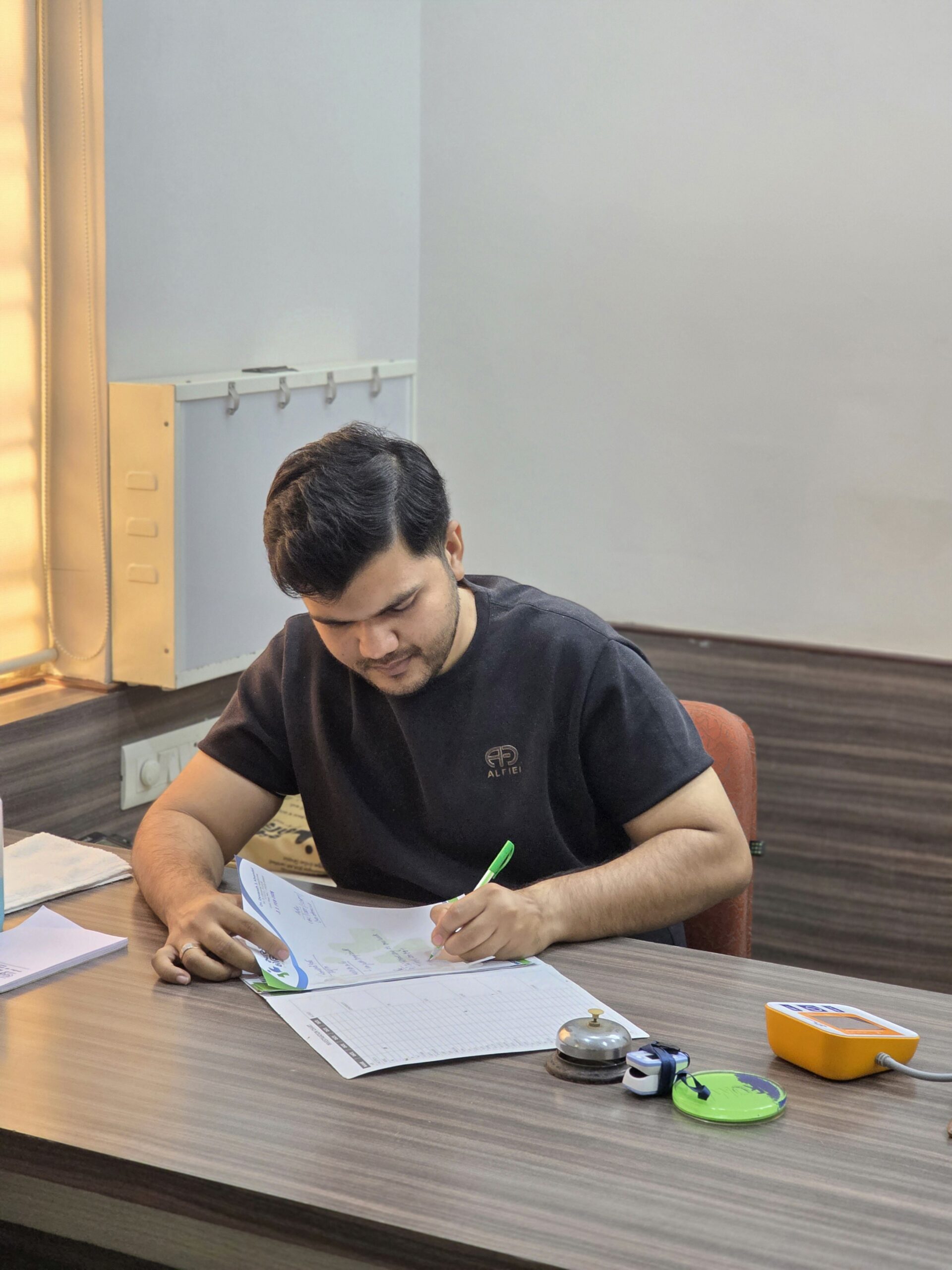 Dr. Devansh J. Khandol consulting a patient at Swasthya Hospital